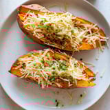 Gooey cheese melts into tender Sweet Potato & Cheese Whole Roast, a comforting, delicious, easy dinner.