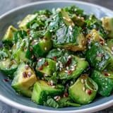 Creamy avocado and crisp smashed cucumber salad, perfect as a refreshing side dish.