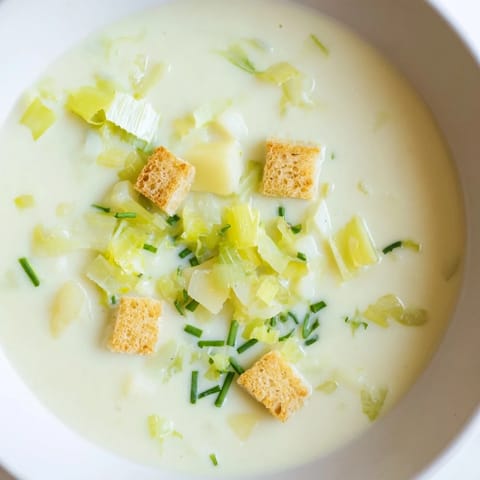 A warm bowl of Quick & Simple Potato and Leek Soup, aromatic and rich, ready for a cozy, delicious dinner.