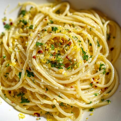 Steaming bowl of flavorful garlic butter noodles, ready for a quick and comforting vegetarian meal.
