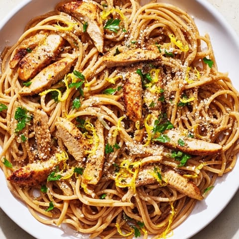 A close-up of Brown Butter Lemon Chicken Pasta with tender chicken, nutty butter sauce, and steam rising for a cozy weeknight meal.  
