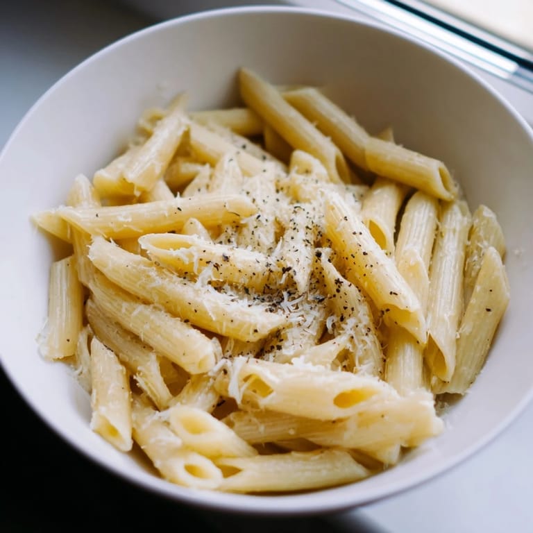 Freshly ground black pepper and olive oil garnish this convenient one bowl pasta meal for one.