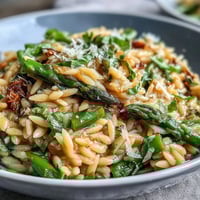Spring Orzo Primavera with vibrant spring vegetables and creamy parmesan.